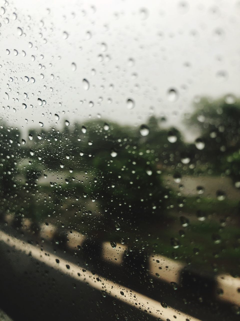 RAINDROPS ON GLASS WINDOW