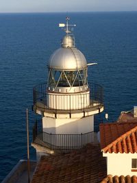 View of built structure by sea