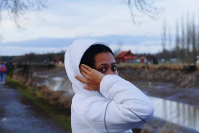 Portrait of woman standing outdoors