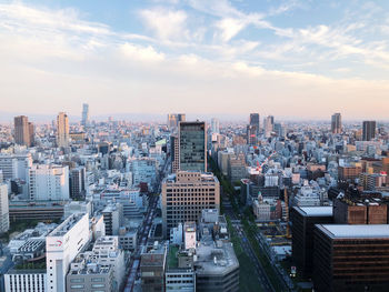 High angle view of modern buildings in city against sky