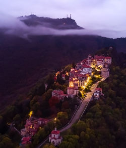 High angle view of illuminated buildings in city at night