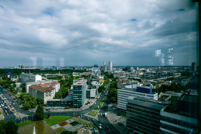 High angle view of buildings in city against sky