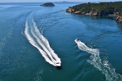 High angle view of boat sailing on sea against sky