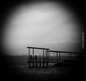 Scenic view of sea against sky at dusk