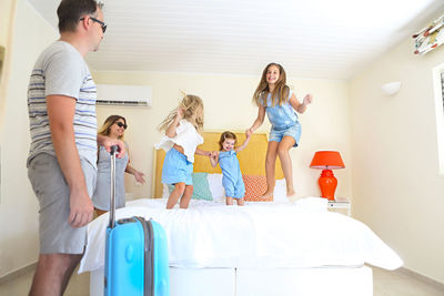 Happy family in hotel room