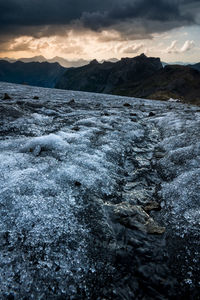 Scenic view of snowcapped mountains against sky