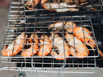High angle view of meat on barbecue grill
