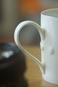 Close-up of coffee cup on table