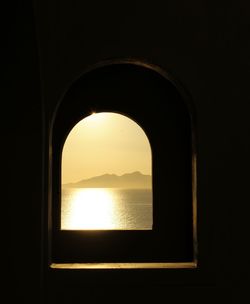 View of sea seen through window