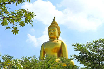 Low angle view of statue against sky
