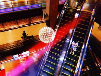 People in illuminated building