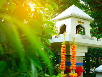 Low angle view of cross by building