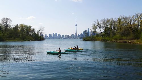 People kayaking in river