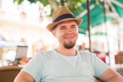 Portrait of young man wearing hat