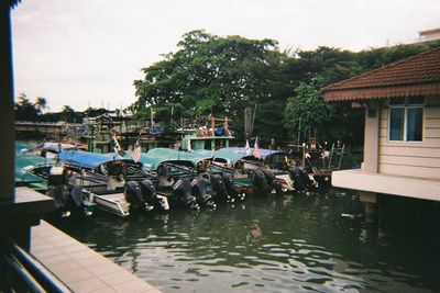 Group of people in front of building against sky