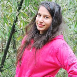 Portrait of smiling young woman outdoors