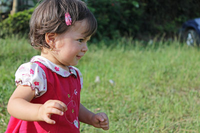 Portrait of happy girl in grass