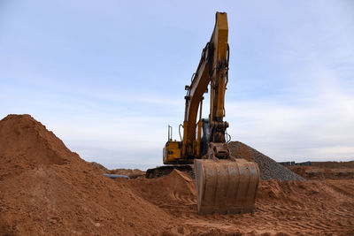 Construction site on field against sky