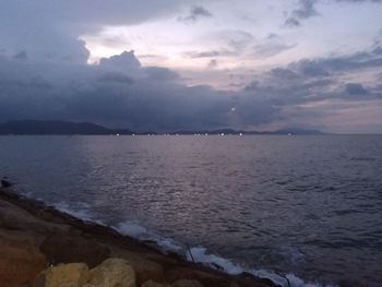 Scenic view of sea against sky at sunset