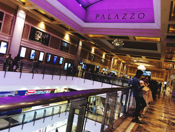 People standing in illuminated store