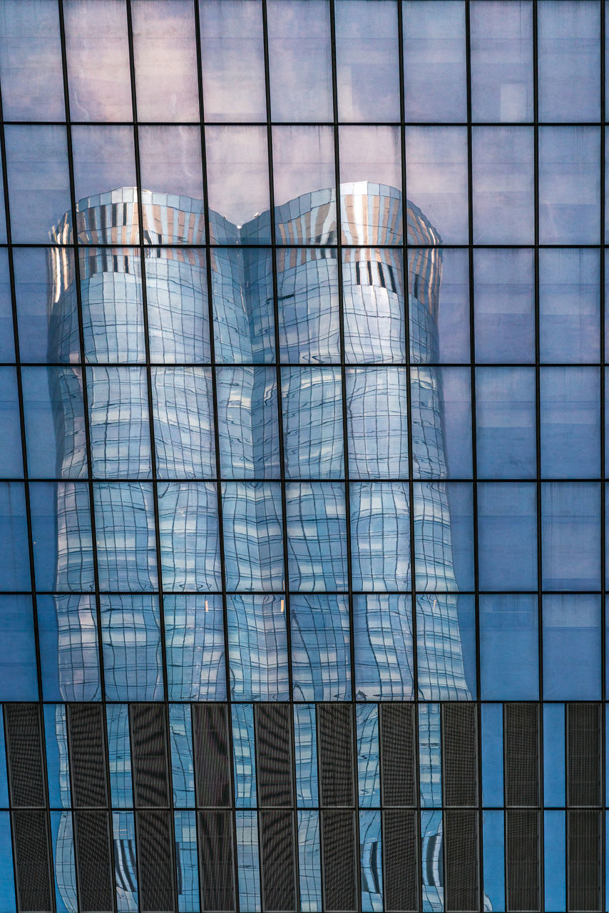 DIGITAL COMPOSITE IMAGE OF MODERN BUILDING AGAINST SKY