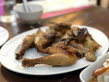 Close-up of roast chicken in plate on table