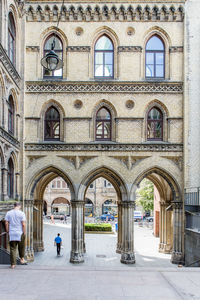 People walking in front of building