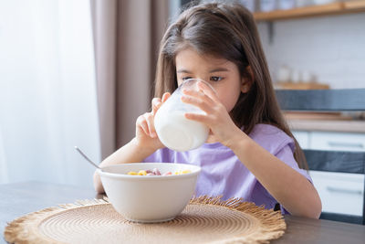 Cute girl having breakfast