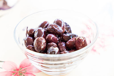 Close-up of fruits in glass bowl on table