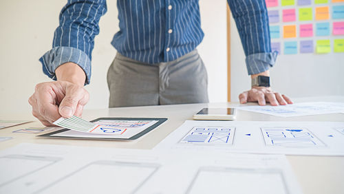 Low angle view of people working on table