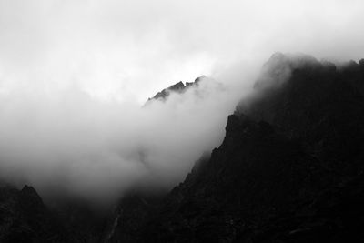 Scenic view of mountains in foggy weather