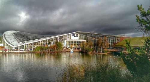 Built structures against cloudy sky