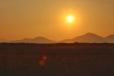 Scenic view of mountains at sunset