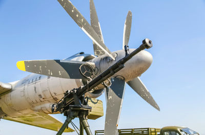 Low angle view of airplane against clear sky