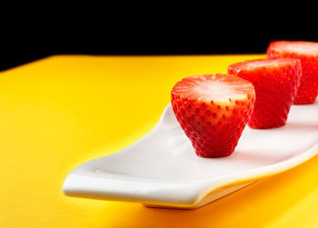 Close-up of strawberry in plate on table