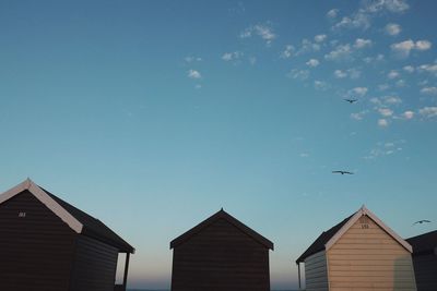 High section of building against blue sky