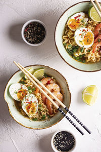 Bowl of ramen soup with shrimps and eggs