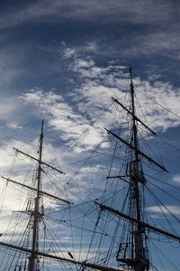 Low angle view of sailboat sailing on harbor against sky
