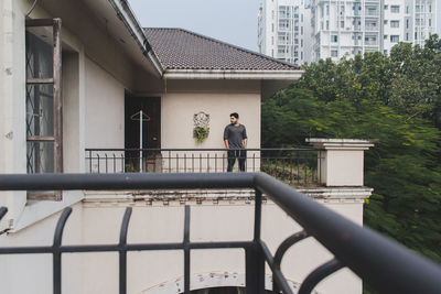 Low angle view of built structures with small male figure in the distance