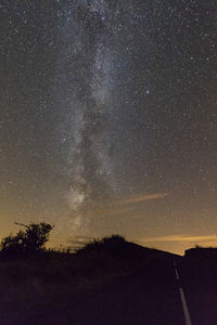 Scenic view of star field against sky at night