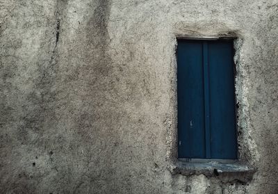 Closed door on old house