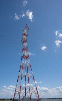 Low angle view of communications tower against sky