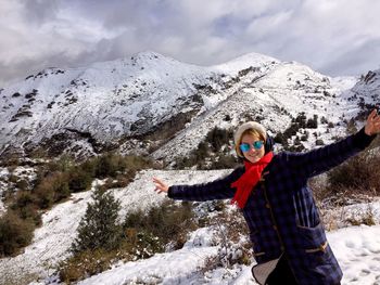 Scenic view of snow covered mountains