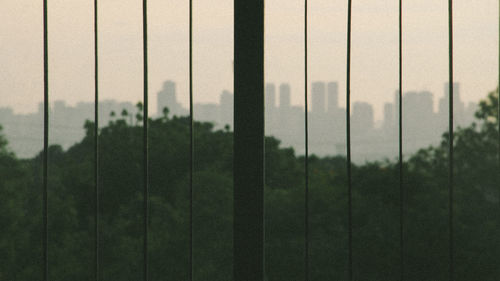 Scenic view of field seen through fence