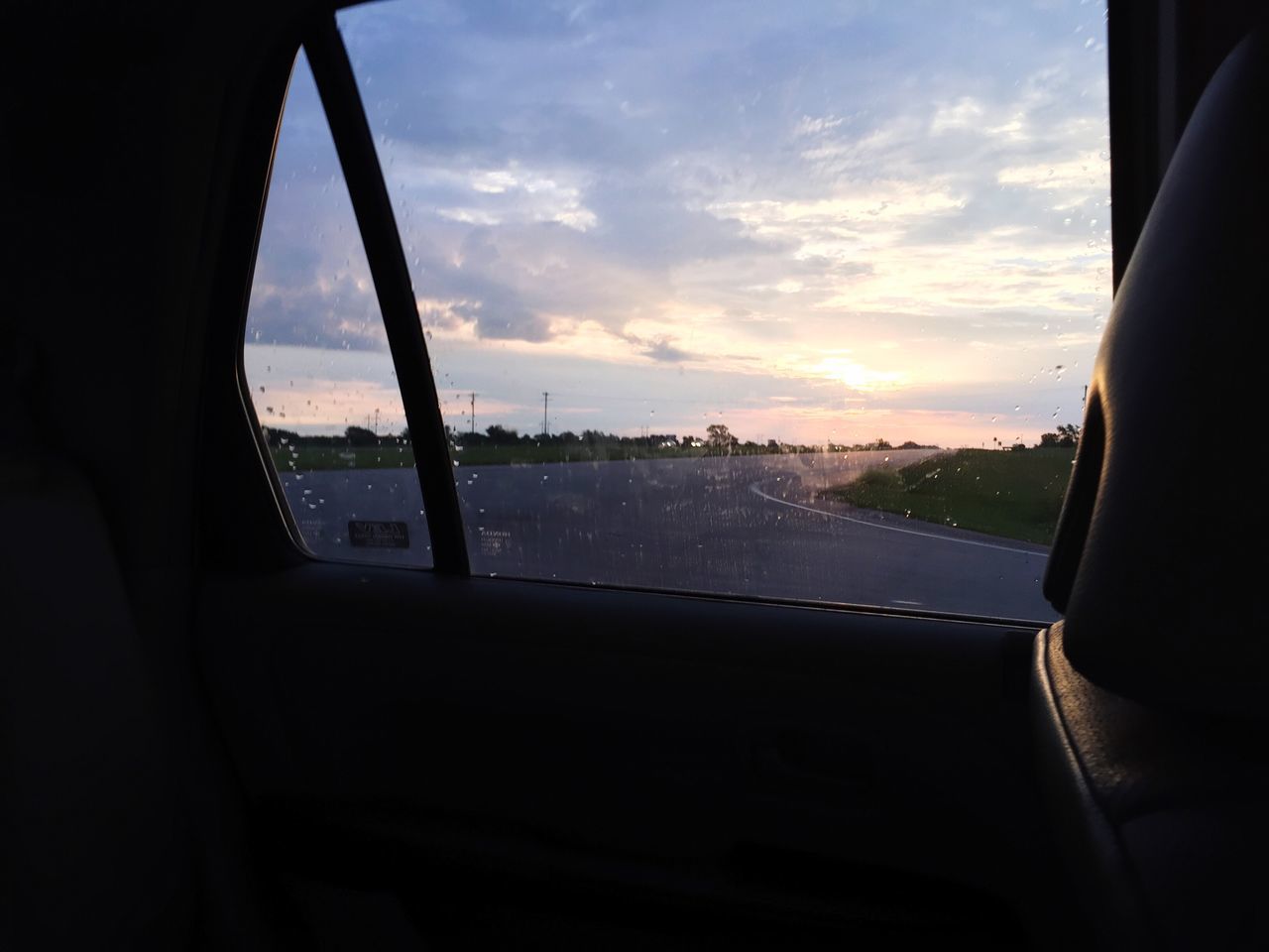 window, sky, transportation, indoors, sunset, mode of transport, cloud, transparent, glass - material, looking through window, cloud - sky, vehicle interior, dark, cloudy, cloudscape, nature, journey, no people, vehicle