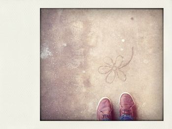 Low section of woman standing on tiled floor