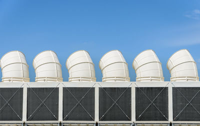 Low angle view of building against clear blue sky