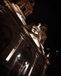 Low angle view of statue of building at night