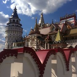 Low angle view of building against cloudy sky