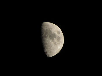 Low angle view of moon against clear sky at night